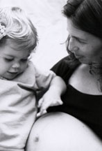 Pregnant mother with daughter